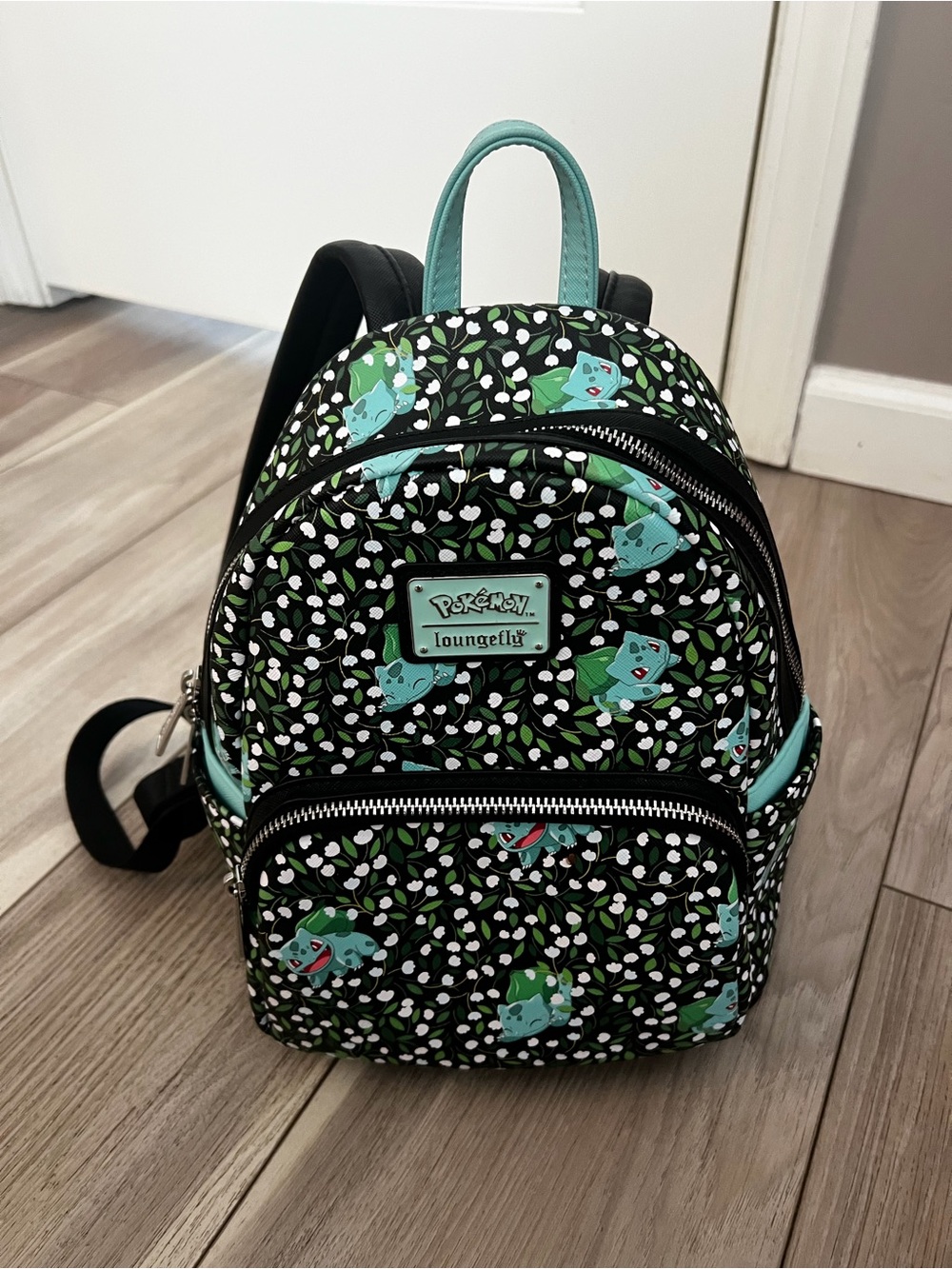 Loungefly Black Mini Backpack with Teal Bulbasaur and Green Leaf Pattern